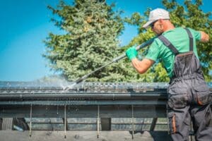 Roof and Gutters Power Cleaning Using Pressure Washer.